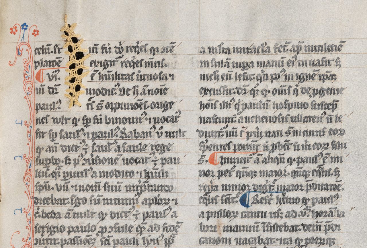 Repairs in yellow thread in James of Voragine’s 14th-century text <em>Golden Legend</em>.  