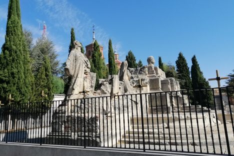 The old monument  is protected behind a fence