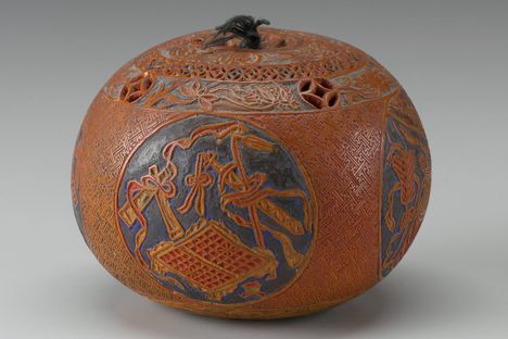 Spherical cricket container, date unknown, artist unknown.