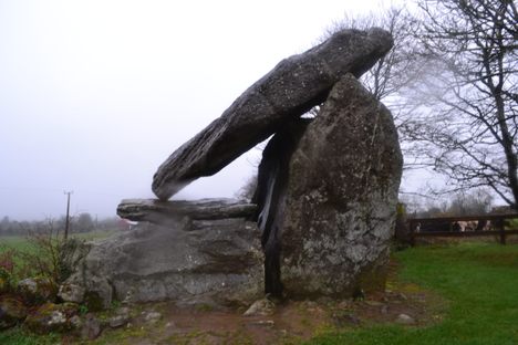 The three massive stones resting on the tomb.
