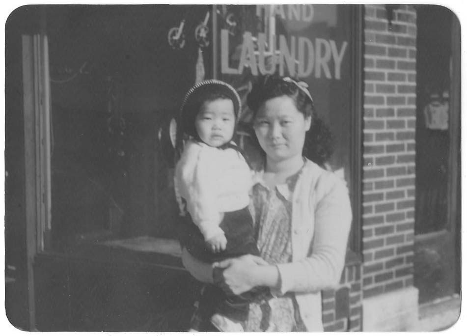 Alice Lee Hum with her mother Jean, at a laundry on 21st Ave in Astoria, Queens, c. 1951. 