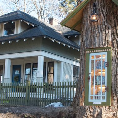 The Little Free Library next to its house.