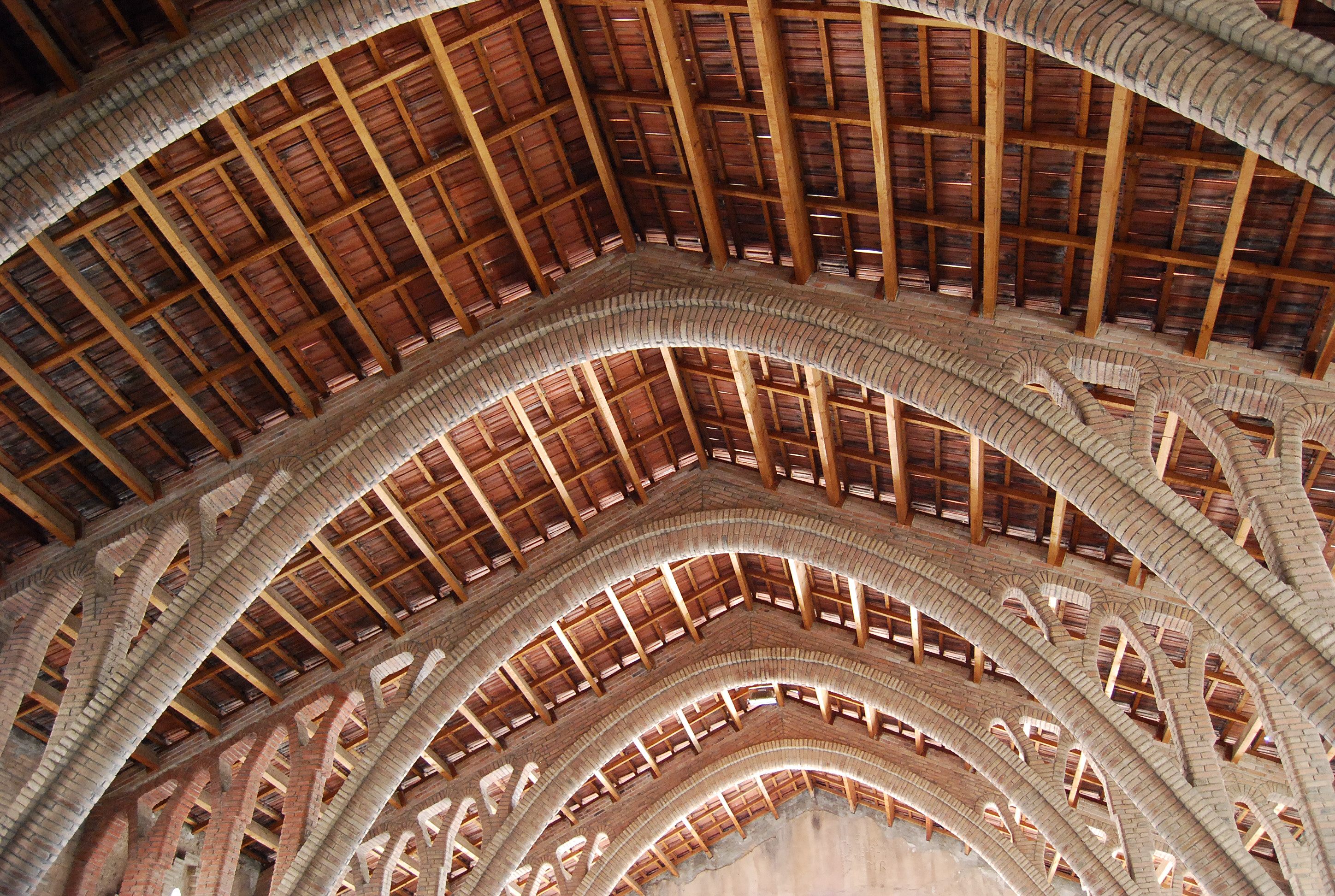 The soaring ceiling of El Pinell de Brai's "wine cathedral," also designed by Cèsar Martinell.
