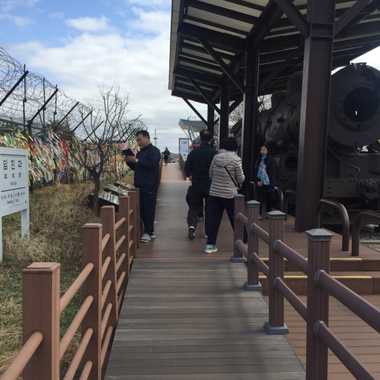 South Korean visitors often tie colored ribbons to nearby fences to remember loved ones across the border.
