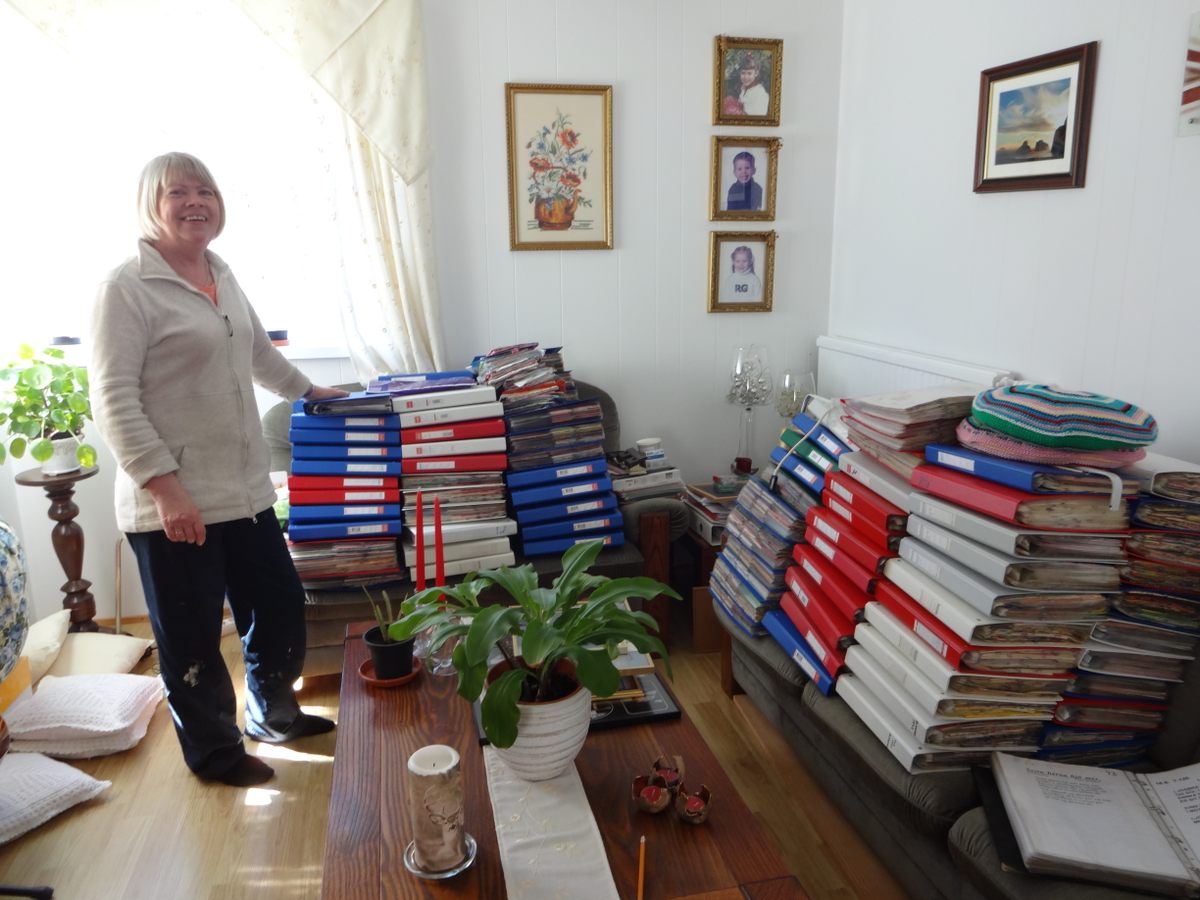 Eygló Ingólfsdottir with her napkin collection in the town of Heimaey.