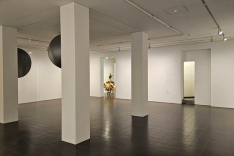 The room with four columns, with the entrance to the room where the artwork is located on the right.