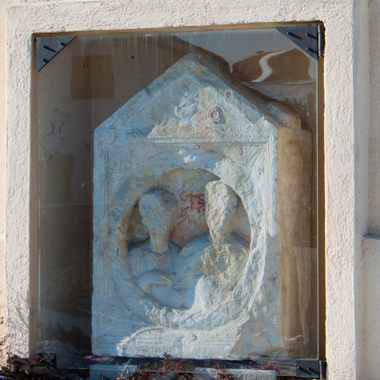 The Roman gravestone mounted in the wall of the church.