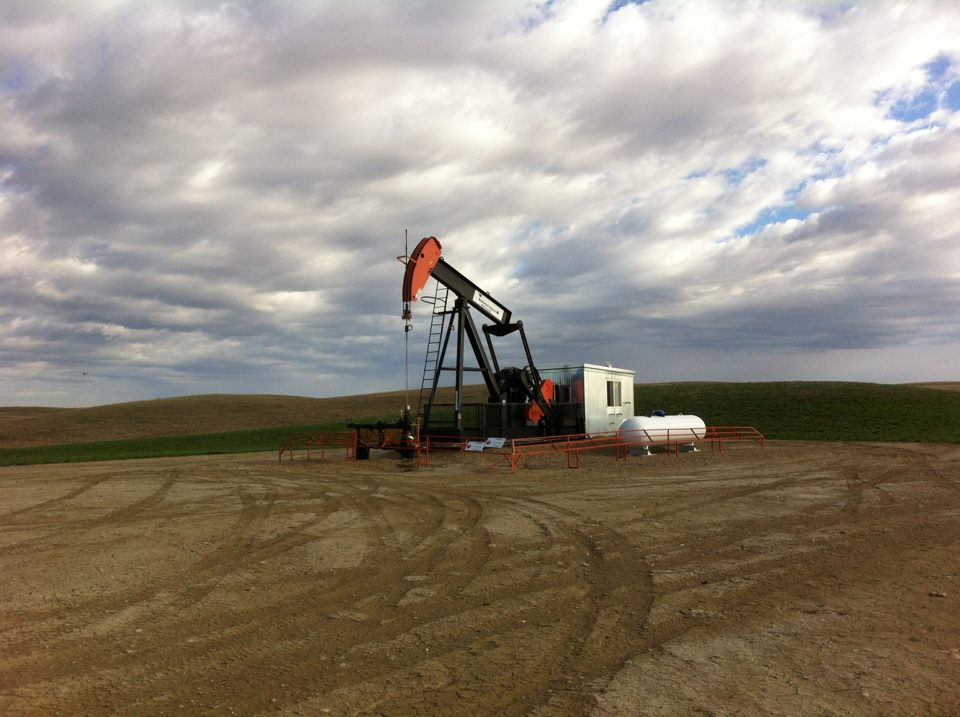 An oil pump jack on the prairie.