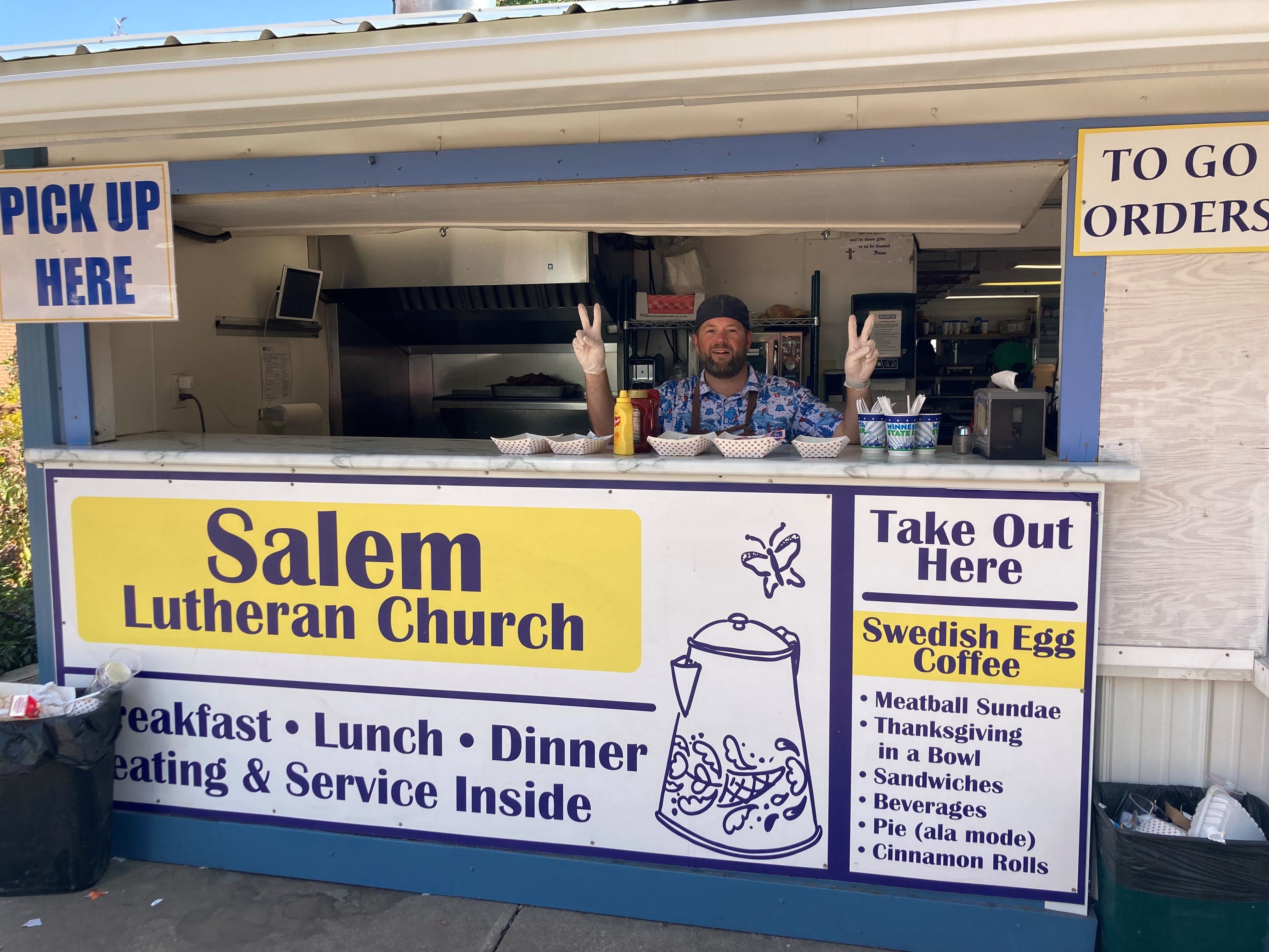 Pastor Adam from Trinity Lutheran Church in Long Lake helps out at the Salem Lutheran Church dining hall at the Minnesota State Fair.
