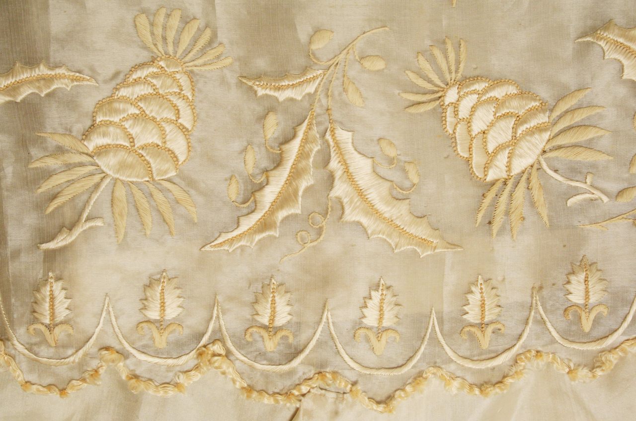 A detail from a Regency-era dress made of silk and piña.