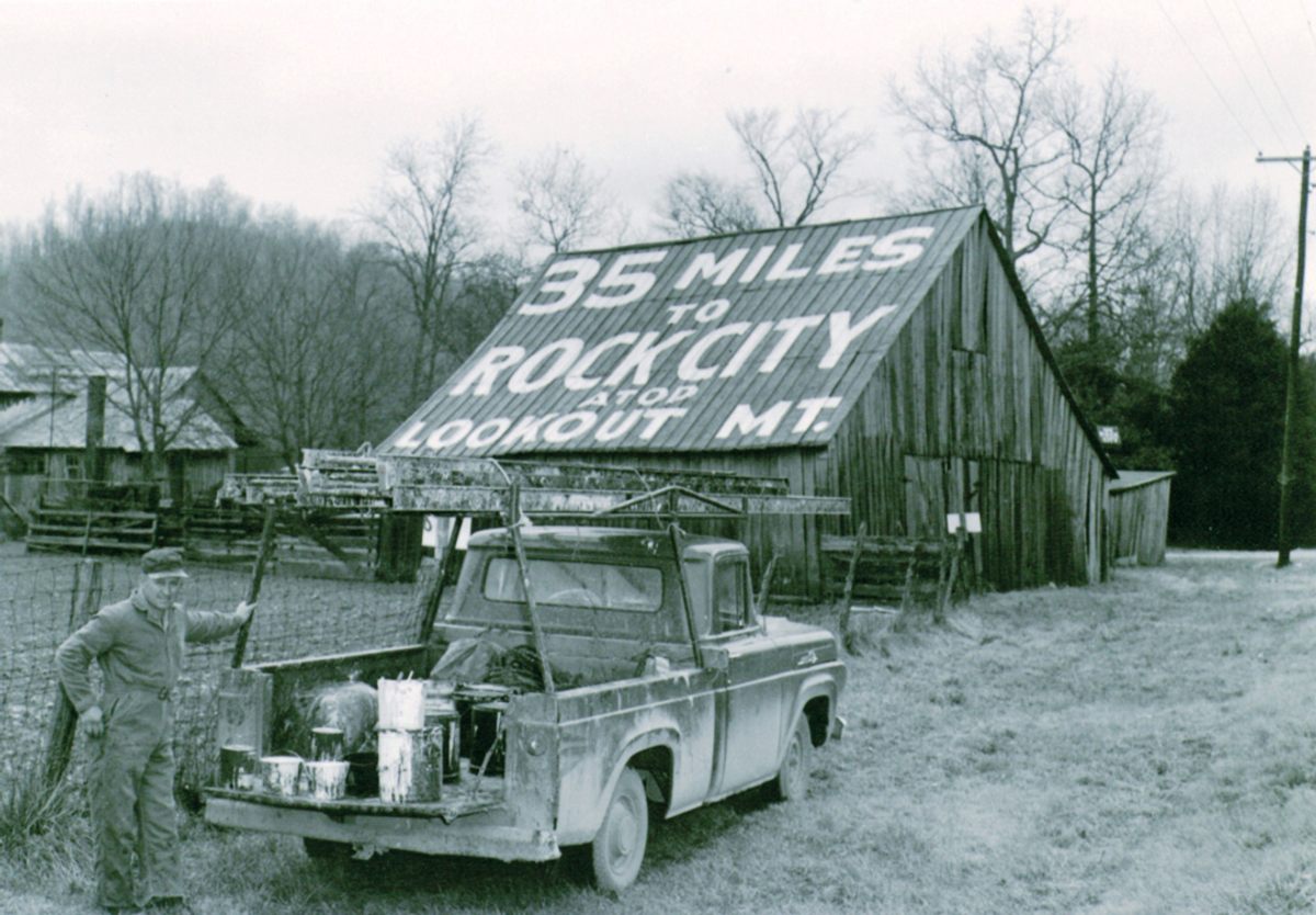 Clark Byers poses at the first Rock City barn, in Kimball, Tennessee, painted in the mid-1930s. Byers ultimately painted about 900 hundred barns with Rock City advertisements.