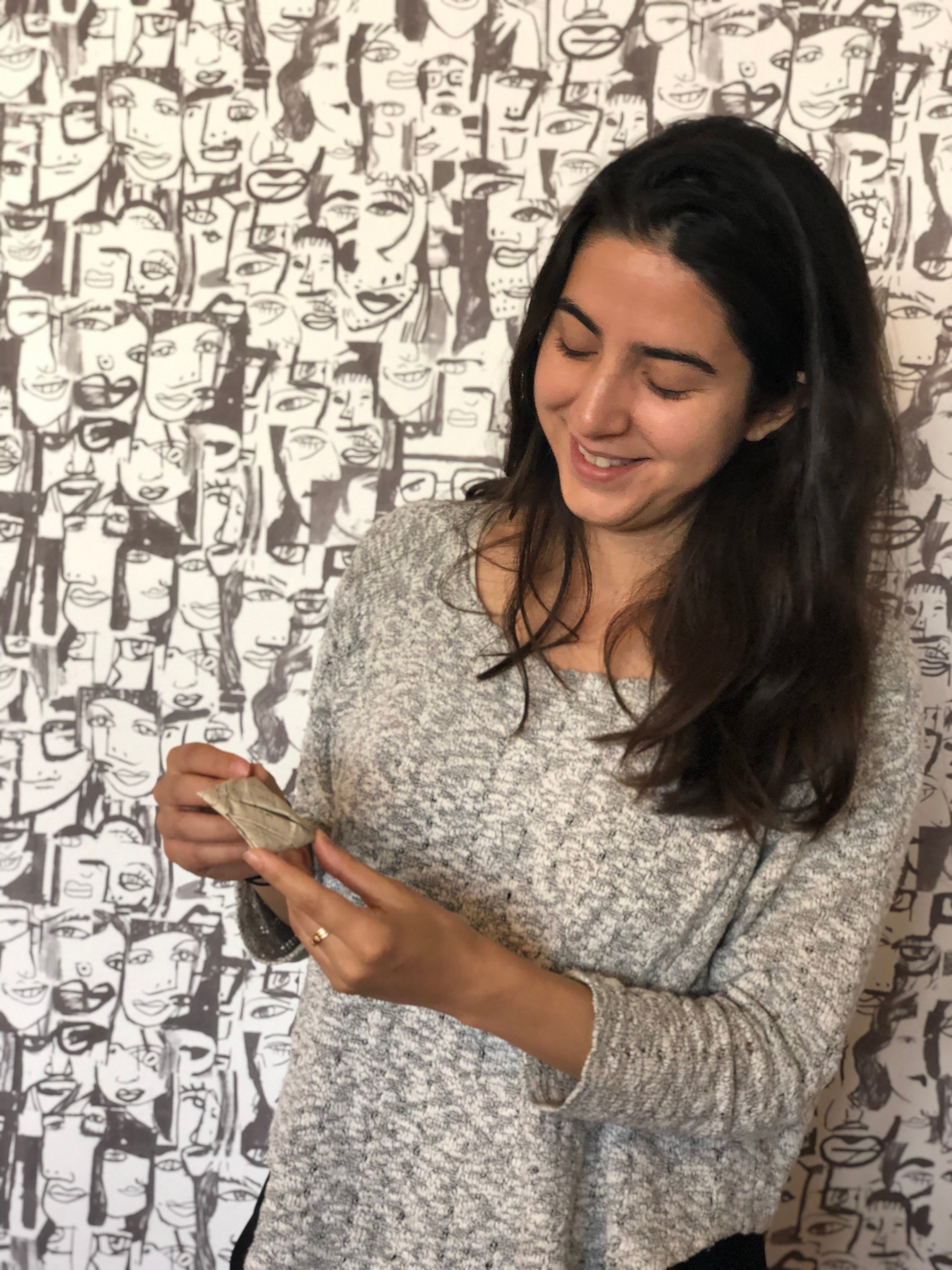 Unlocking History Research Group member and Research Engineer at Adobe, Amanda Ghassaei, with a sealed letter packet.