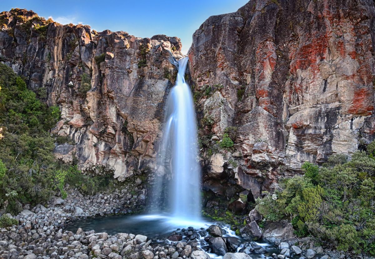 Taranaki Falls, where the water cascades 20 meters over a 15,000-year-old lava flow to crash into the pool below, Tongariro National Park, New Zealand.