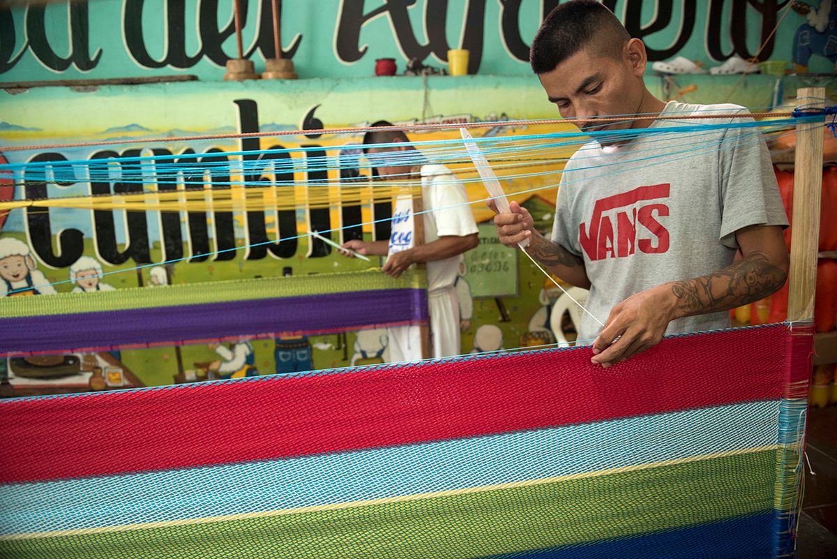Hammocks are made by hand in El Salvador, in this case as part of a prison rehabilitation program.