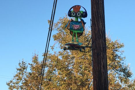 This sculpture looks like it will skate on car passing by. 