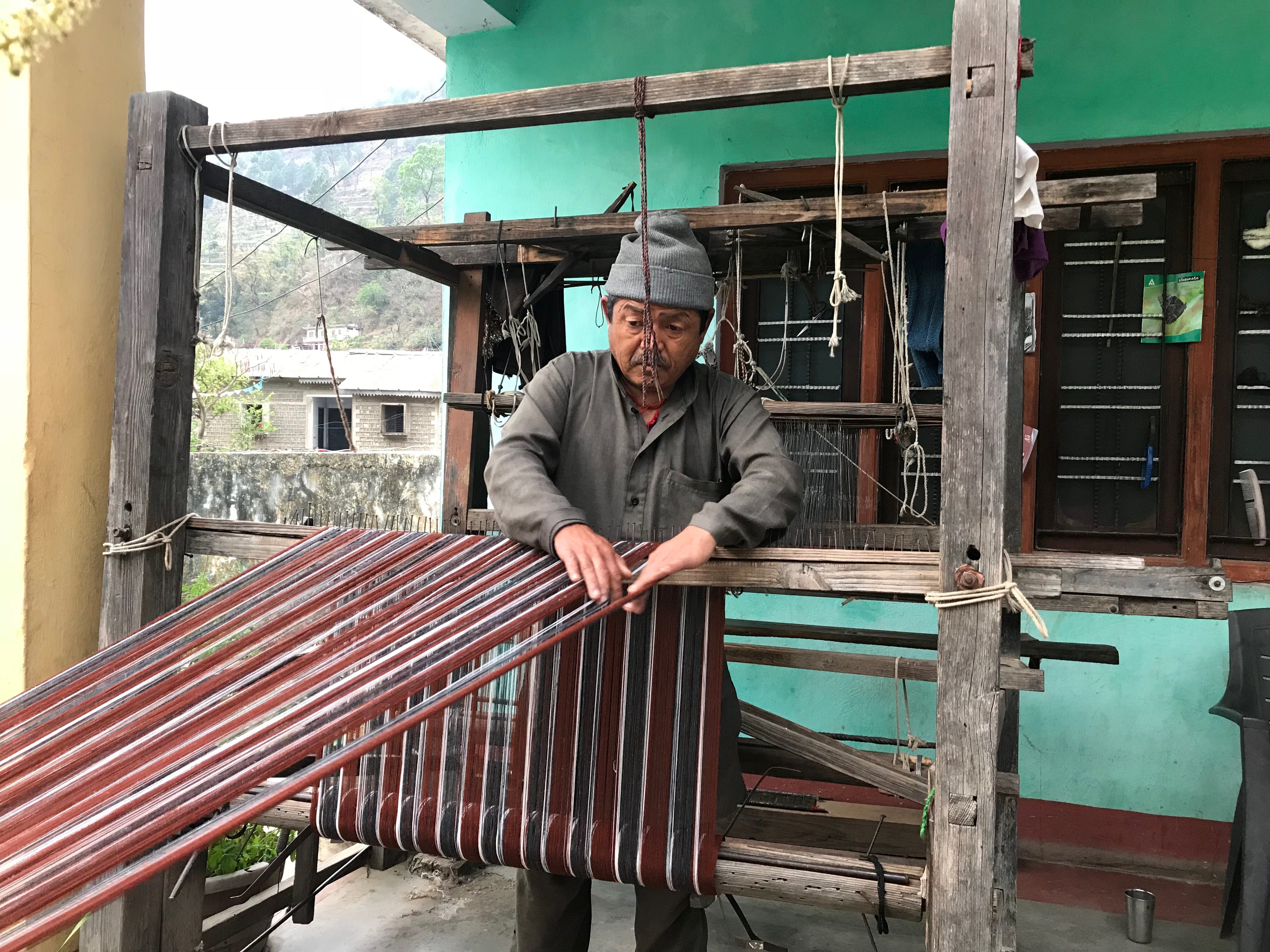 Shyam Singh Rana weaving wool on a loom in Dunda village, Uttarakhand.*