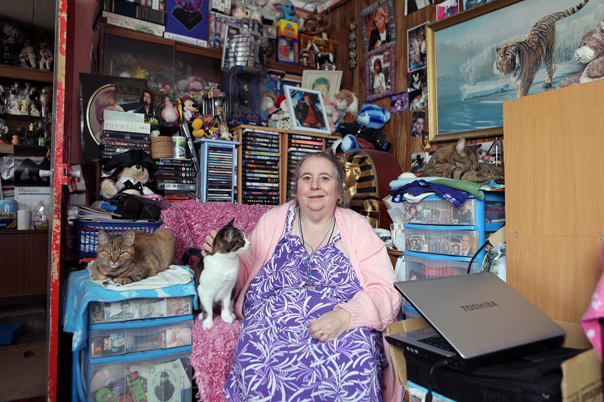 Christine Gregory in her prefab living-room, Excalibur Estate, 2013.