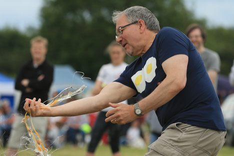  A competitor fails to catch a thrown egg without it smashing during an egg throwing discipline of the 2017 World Egg Throwing Championships