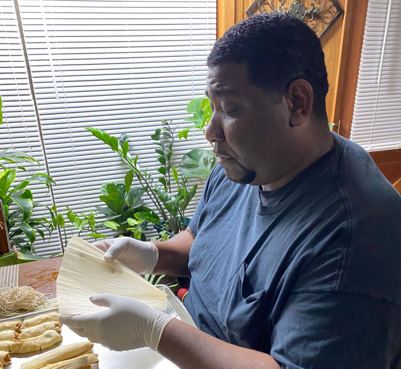 Charles Sledge: a police detective by day, a tamale master the rest of the time.