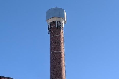 The world's largest lug nut atop a smokestack in Lansing.