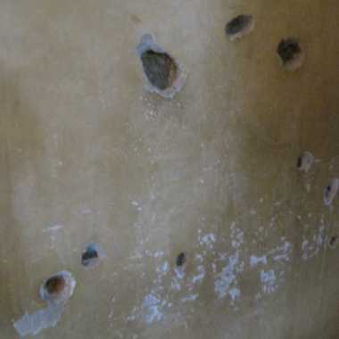 bullet holes in the hallway from assassination attempt #1