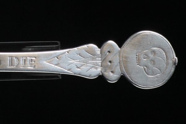 The top of a Strickland spoon. 