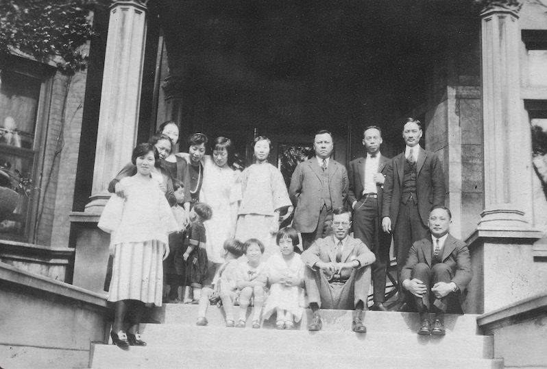 The Chin family on the steps of their new mansion.
