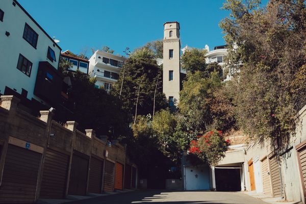The elevator towers over the streets and garages below it.
