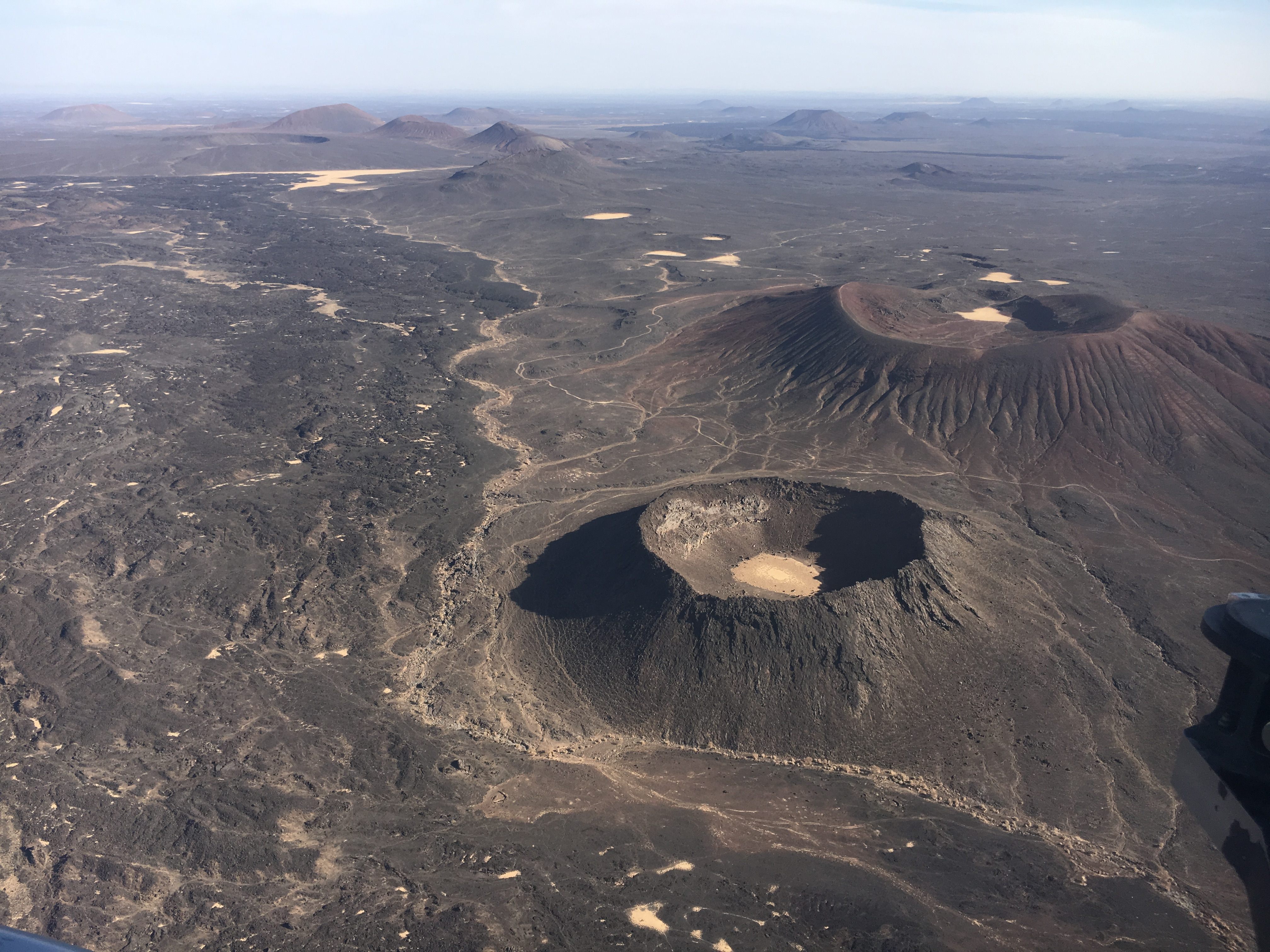 Volcanic cones and lava flows made from basalt.