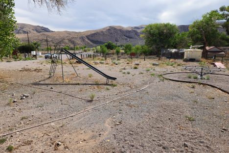 The vintage playground equipment by the schoolhouse.