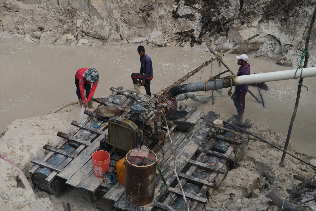 Pork-knockers dredge or pump and filter sediment from the riverbed and banks, looking for gold or diamonds.