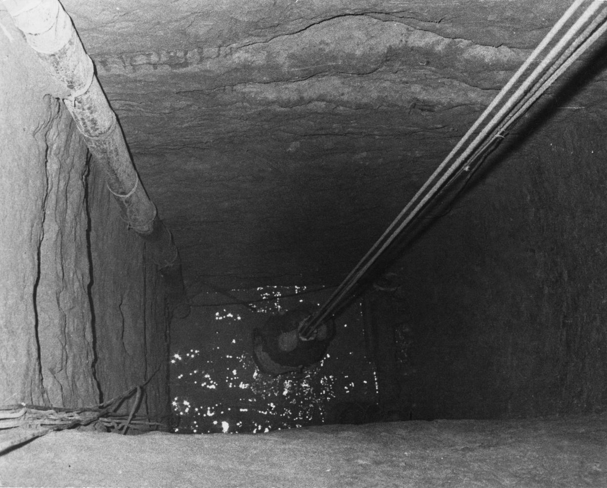 A refugee from East Germany is winched up to the exit of Tunnel 57 and into a disused bakery in West Berlin.