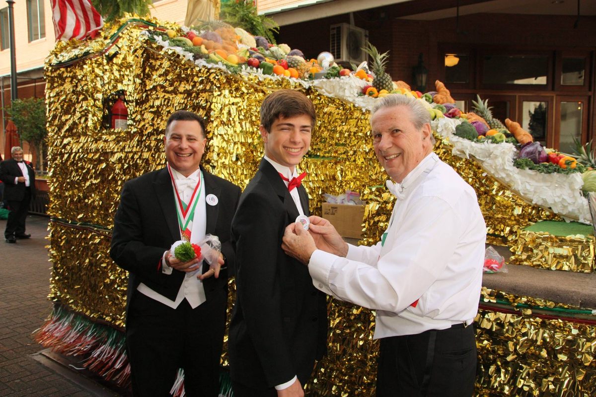 Community members don tuxes in preparation for the 2018 St. Joseph's Day Parade.