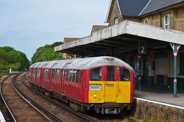 A former London Underground train approaches Sandown station on the Isle of Wight. 