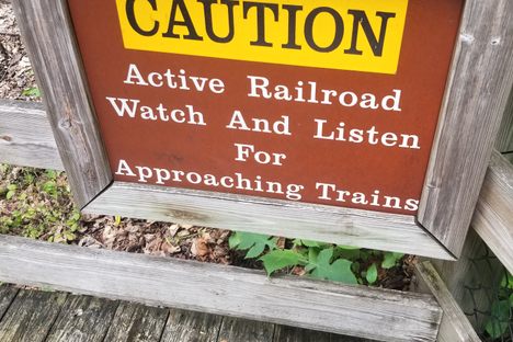 Sign next to railroad leading into Natural Tunnel 