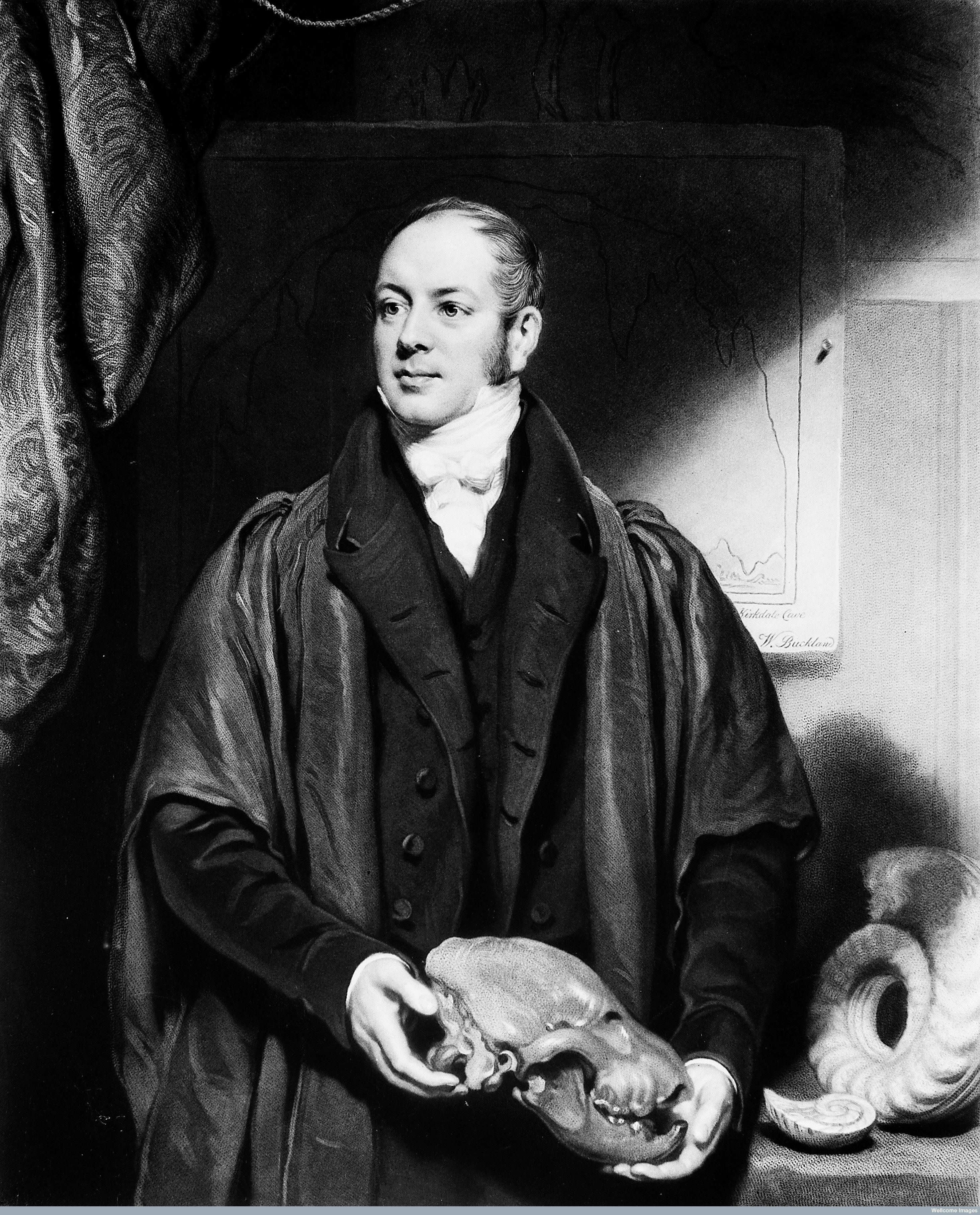 William Buckland holding a hyena skull.