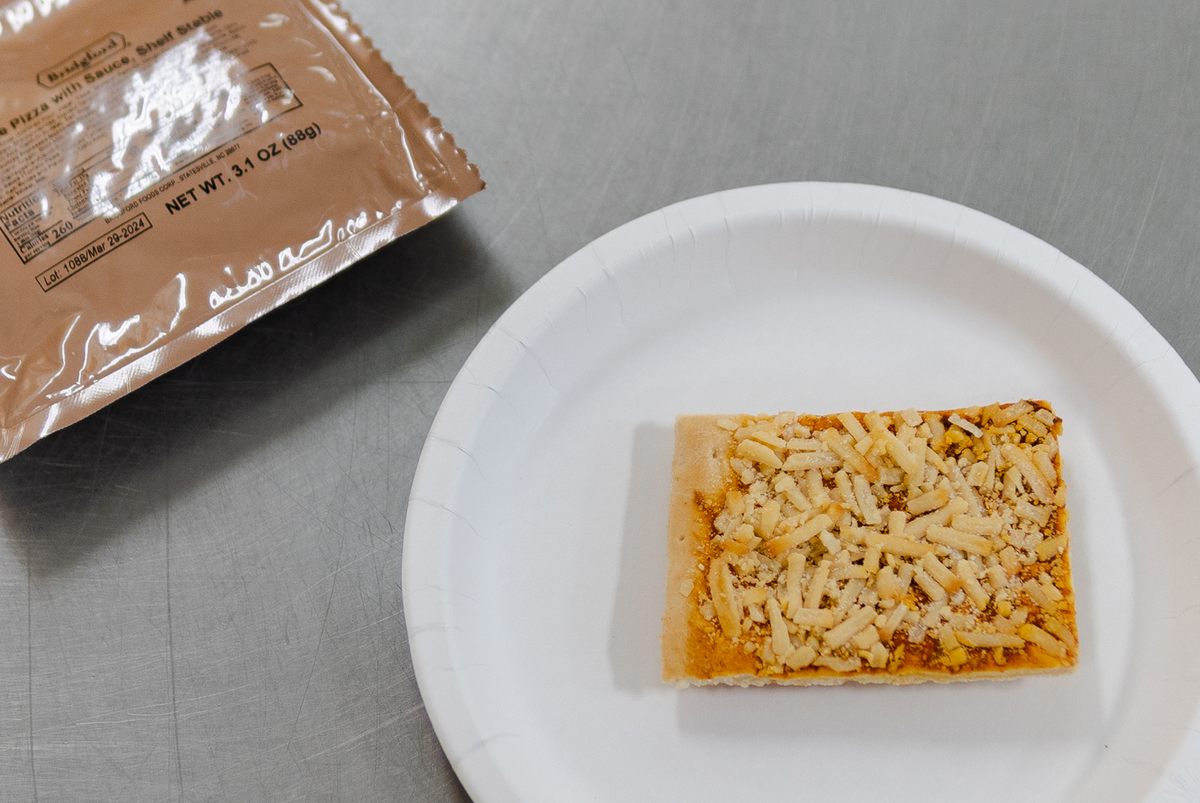 A Ready-To-Eat (MRE) pizza sits on the counter.