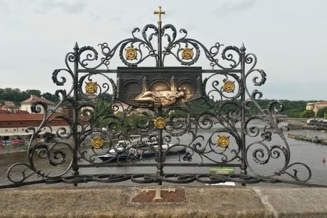 Tableau on the Charles Bridge depicting Saint John at the bottom of the Vltava River.