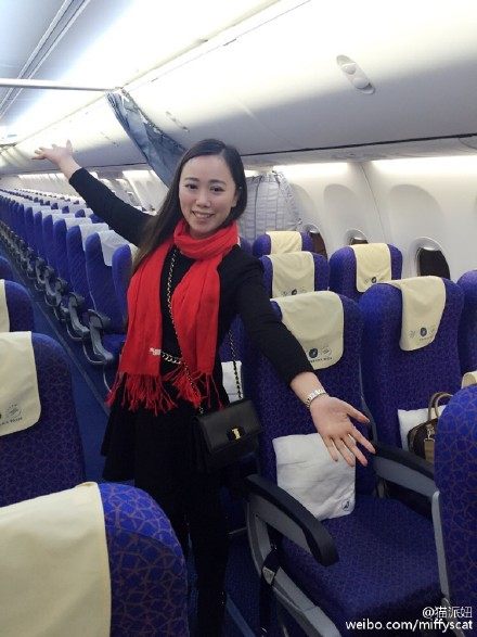 Zhang alone on the plane. 