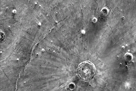 Bright streaks radiate from the Sante Fe Crater on Mars.