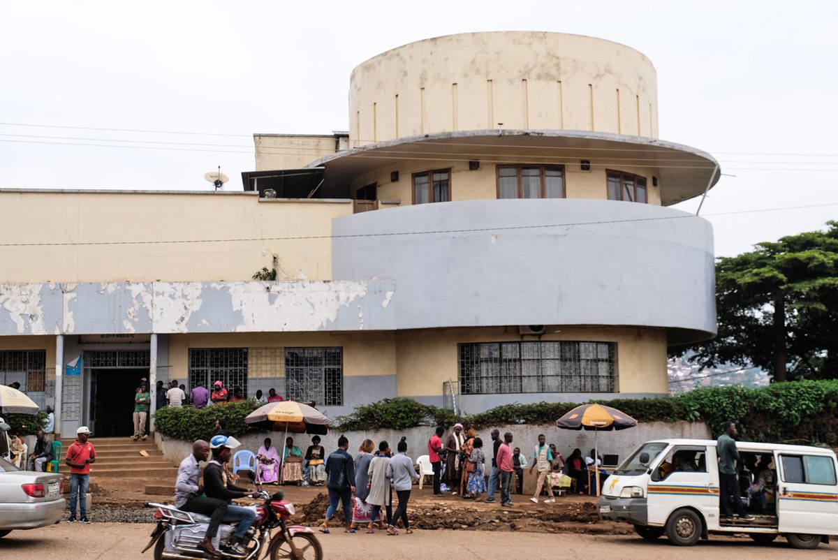 The curved lines of this building are an example of "Streamline Moderne," a type of Art Deco architecture that was inspired by the curved shapes of airplanes. The first floor houses an import/export company called Kotecha, and the upper floor is a residence.