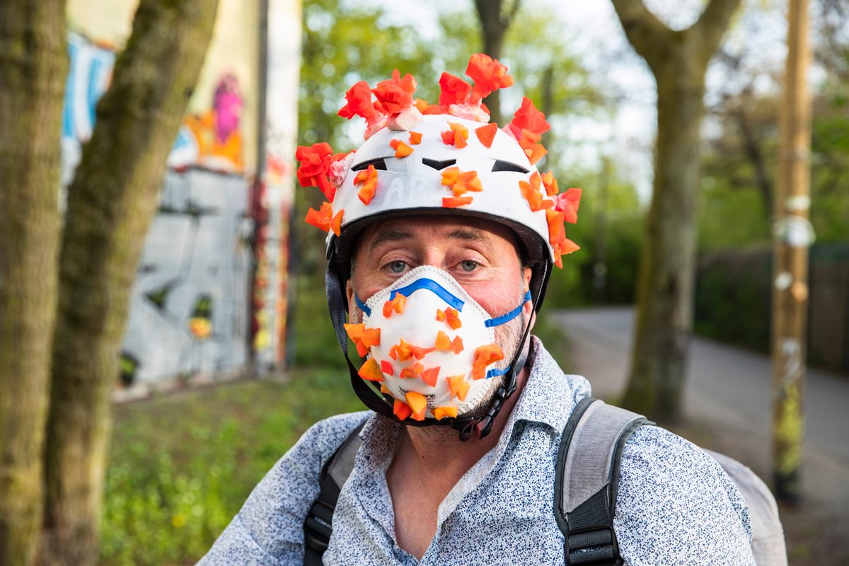 A man in Berlin, Germany, covered both his helmet and mask to depict the coronavirus itself, April 17, 2020.