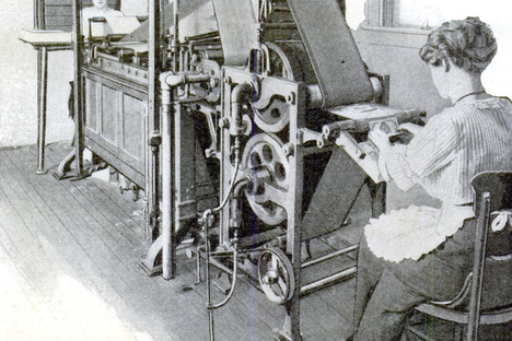 A woman feeds bills into the laundry.