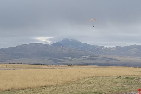 Paramotor pilot taking off from an airfield in Downey, Idaho.