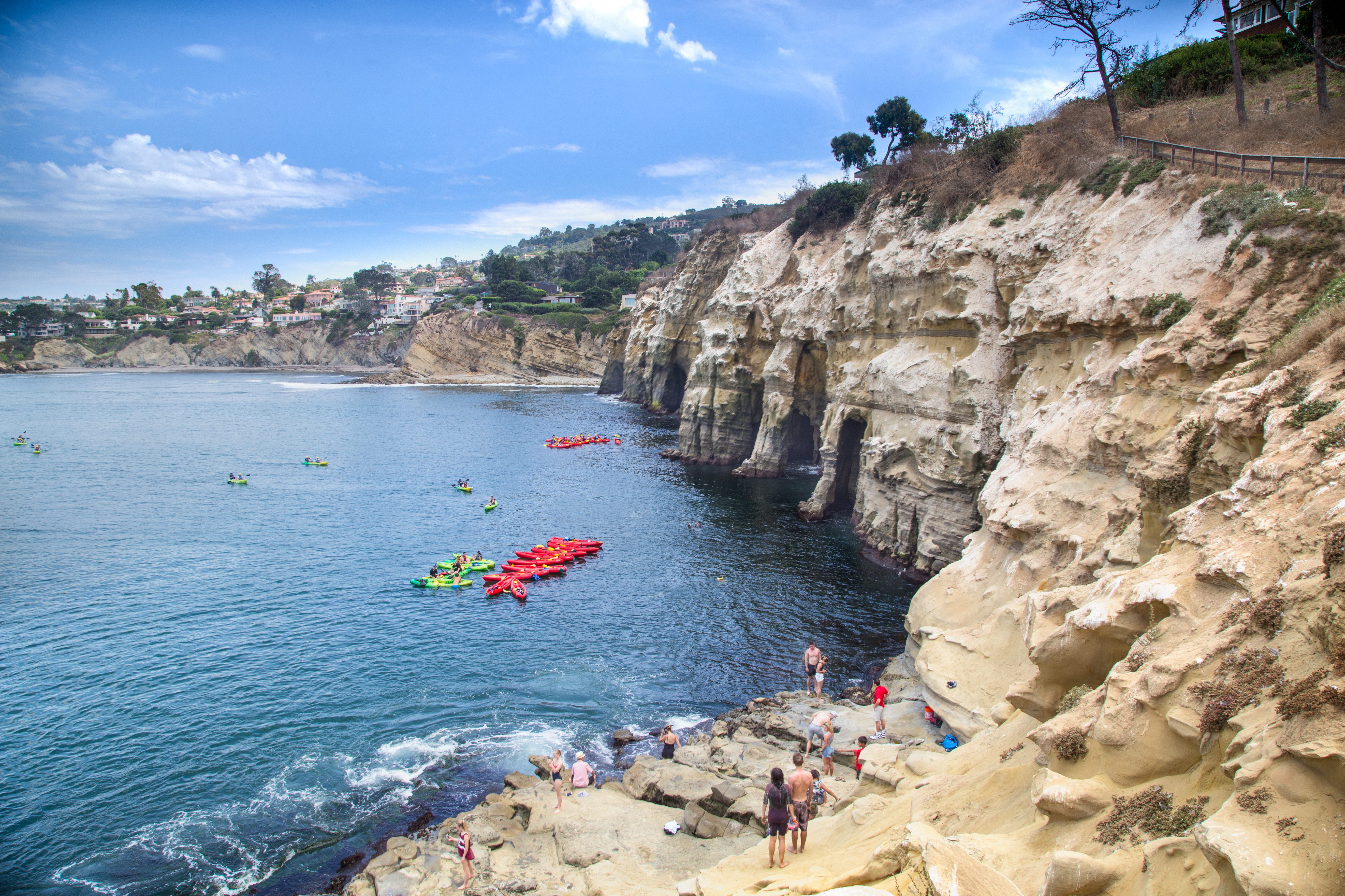 Kayakers get ready to explore sea caves in La Jolla.