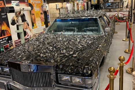 Uri's car, covered in bent spoons of famous people.