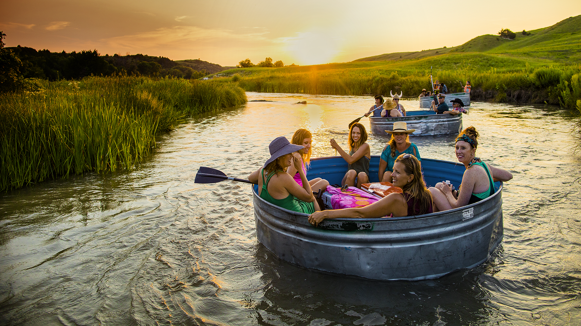 Enjoying a tanking float down the river as the sun sets in the distance. 
