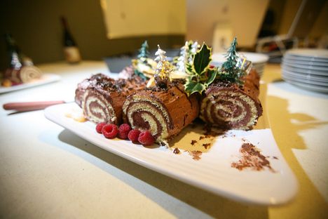 The rolled interior of a yule log cake resembles wood grain.