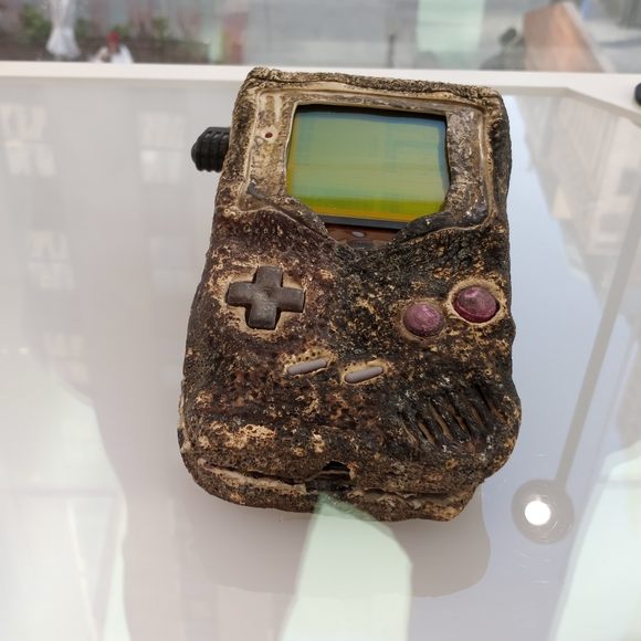 Though The Scorched And The Buttons Half-Melted, This Hardy Handheld Gaming Device Can Still A Game Of Tetris