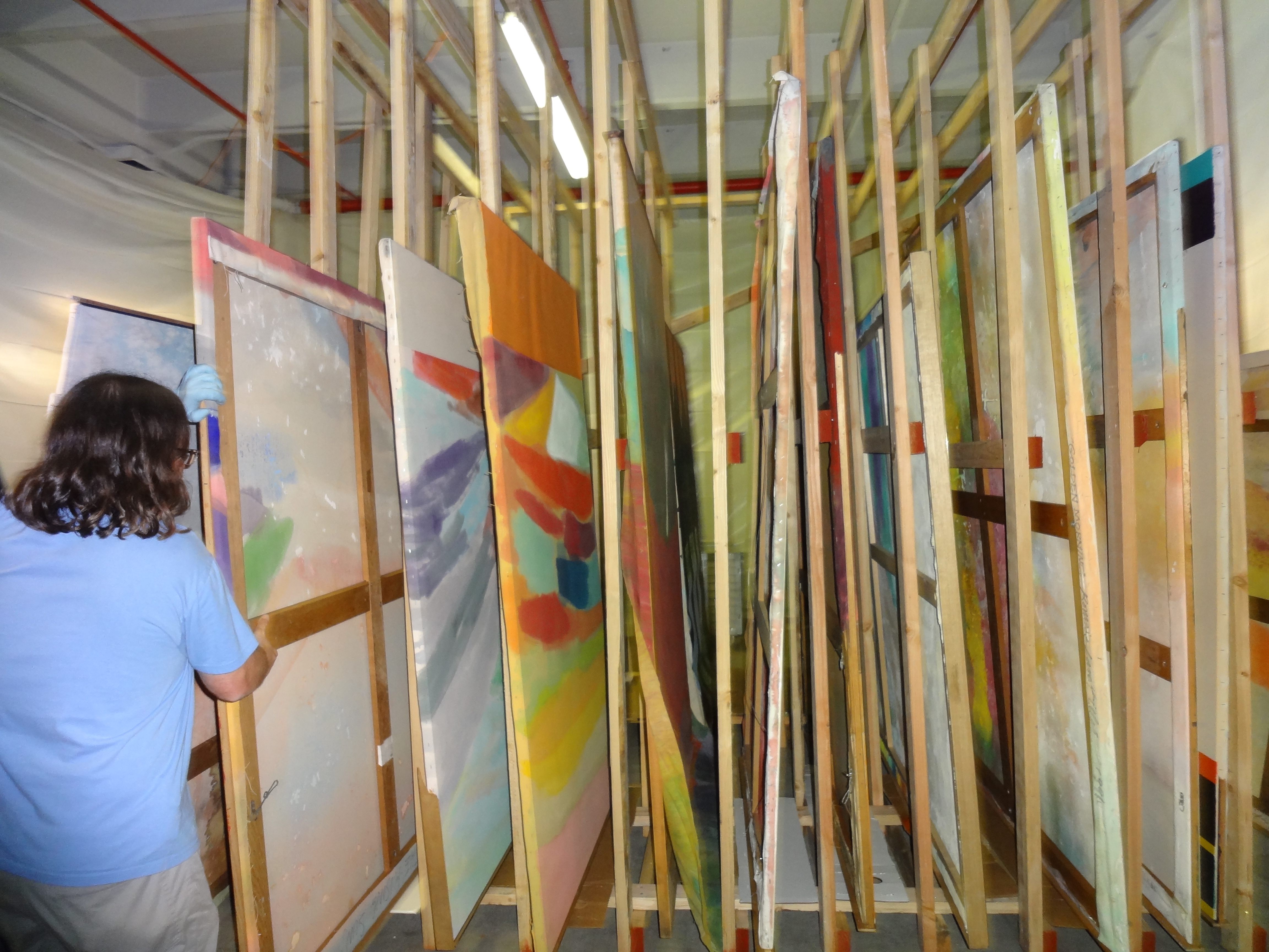 large paintings were stored in specially-built racks, within enclosures that had negative pressure maintained by air filters.